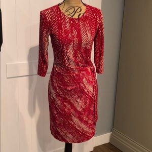 Red and cream colored dress